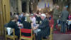 More guests enjoyng dinner in the church